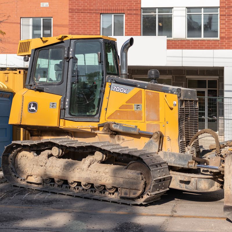 John Deere 700K dozer sitting idle on a job site